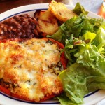 Quinoa-stuffed red pepper with smoked mozzarella, corn, cashews, goat cheese and a medley of vegetables.  Comes with tossed green salad, black beans and chipotle-grilled sweet potatoes.