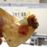 Tofu, tomato and lettuce on a tortilla chip