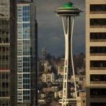 The space needle as seen between buildings