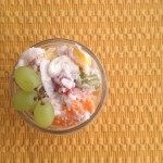 Small mason jar filled with ambrosia fruit salad