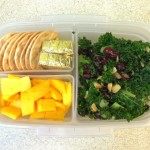 Kale salad, mango, cheese, crackers bento lunch