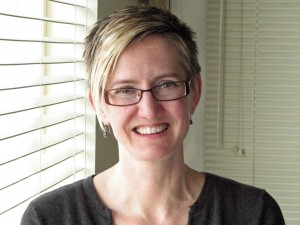 Headshot of woman with short blond hair