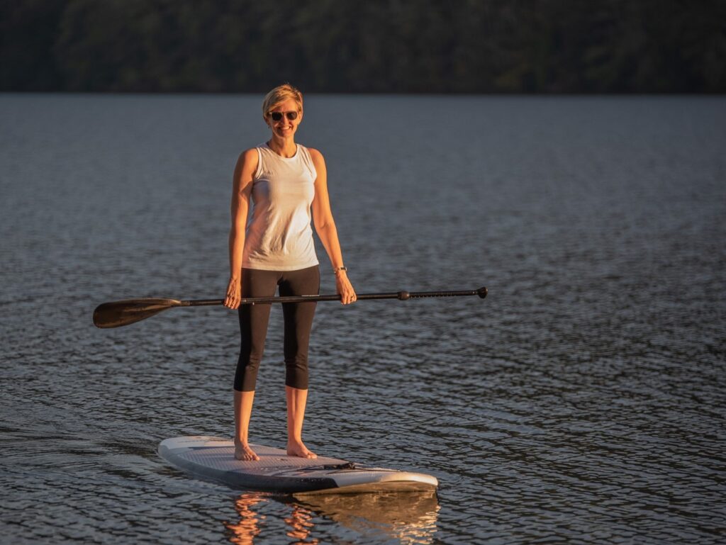 Woman on a paddle board in a lake