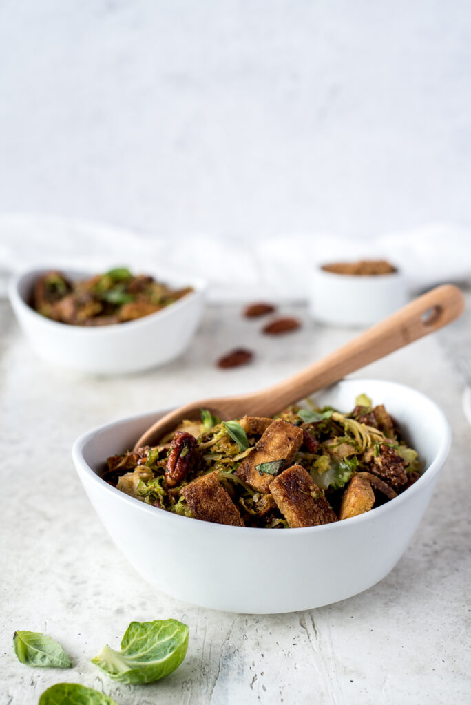 Side view of 2 bowls of brussels sprouts and tofu