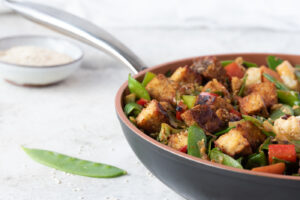 Skillet of stir fry veggies and tempeh