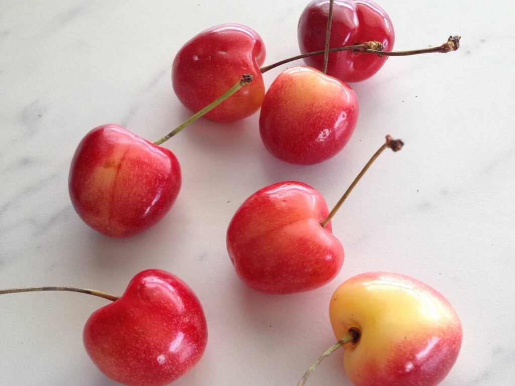 Rainier cherries scattered on counter