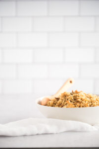 Side view of a white bowl filled with rice