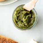 Top down view of jar of pesto