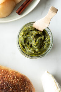 Top down view of jar of pesto