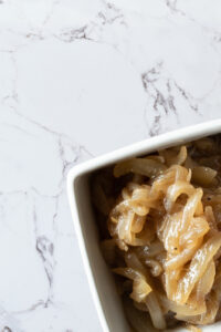 Top down view of bowl of cooked onions