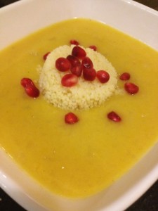 Squash soup with pomegranate garnish