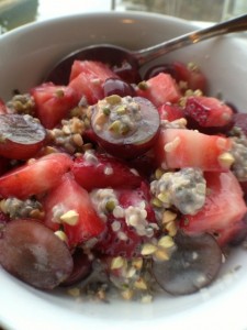 Halved grapes, diced strawberries in a bowl