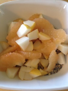Diced pear, grapefruit supremes with cereal in bowl 2