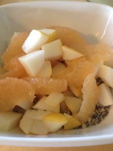 Diced pear, grapefruit supremes and cereal in bowl