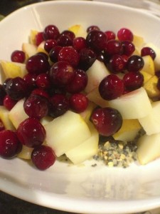 Cranberries, pear and holy crap cereal in a bowl