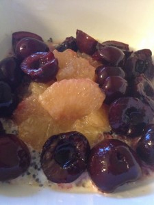 Cherries, grapefruit and holy crap cereal in a bowl