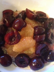 Cherries, grapefruit and holy crap cereal in a bowl