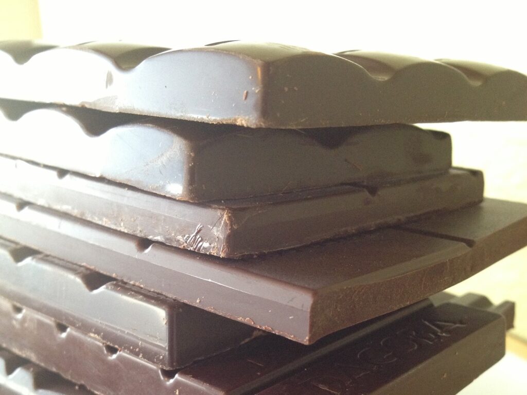 Stack of unwrapped dark chocolate bars