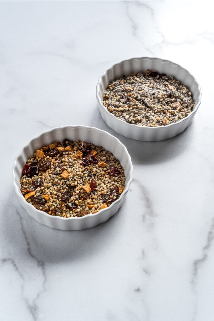 Two bowls of seeds and dried fruit cereal