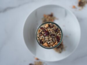 Top down view of whole grain cereal in a jar on a plate