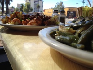 Caramelized cauliflower and green beans on table