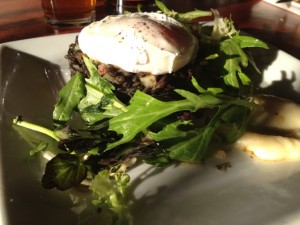 Poached egg on vegetable-lentil hash