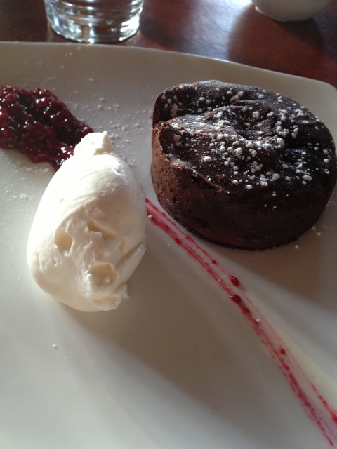 Chocolate cake with fruit compote and whipped cream