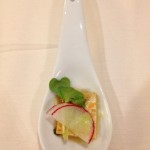 One bite of tofu with radish and sunflower sprouts