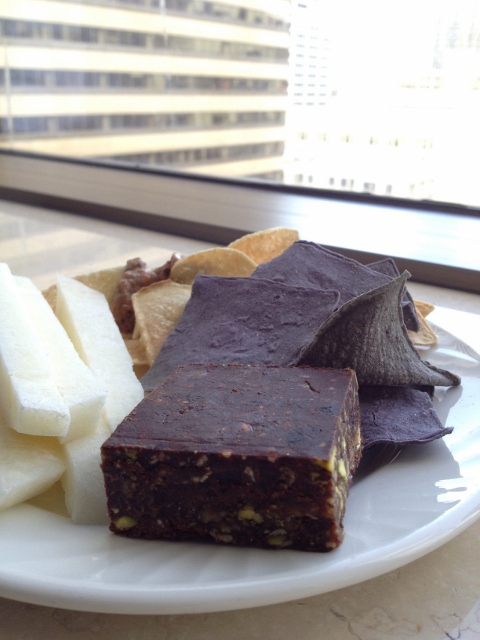 Energy bar, baked corn chips, black bean and red pepper hummus, and jicama sticks