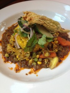 Risotto corn cake on a bed of lentils