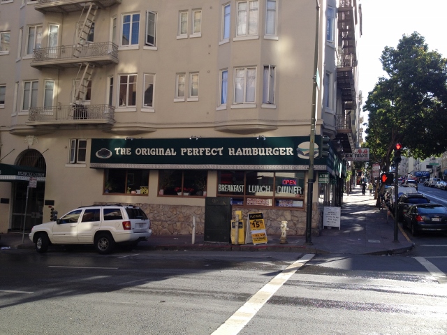 Sign on restaurant claiming the original perfect hamburger