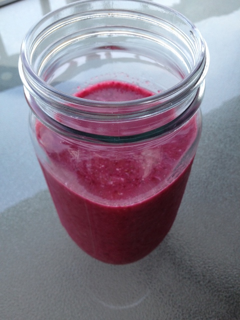 Beet and strawberry smoothie in a mason jar