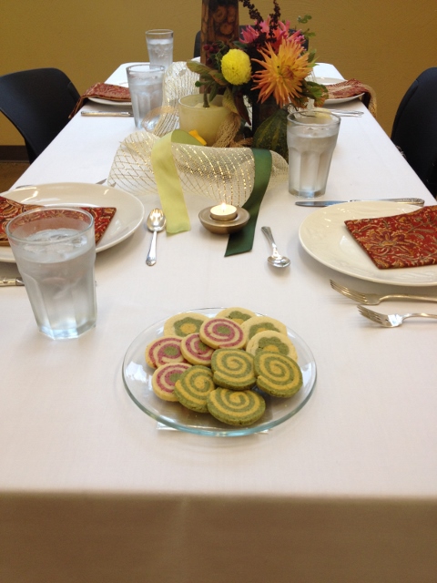 Plate of swirled shortbread cookies on a fancy linen tablecloth