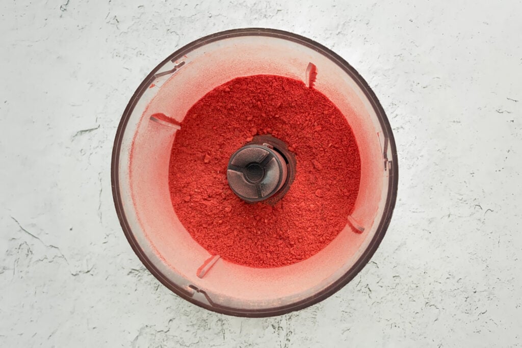 Food processor full of strawberry powder