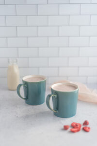 Two mugs of strawberry milk