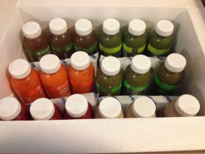 18 bottles of Suja juice in box