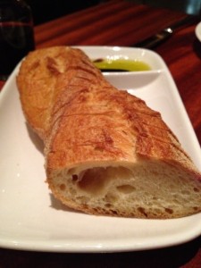 Loaf of Italian bread with olive oil for dipping
