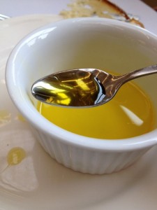 Bowl of camelina oil with spooon