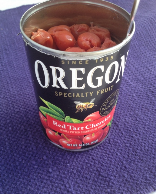 Opened can of pie cherries canned in water