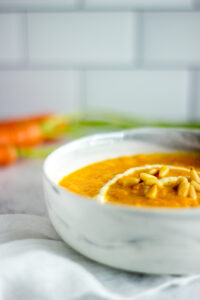 Close up of a bowl of carrot soup