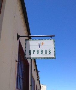 Sign for Greens Restaurant outside the front door