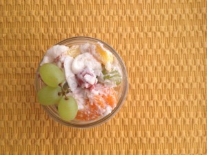 Small mason jar filled with ambrosia fruit salad