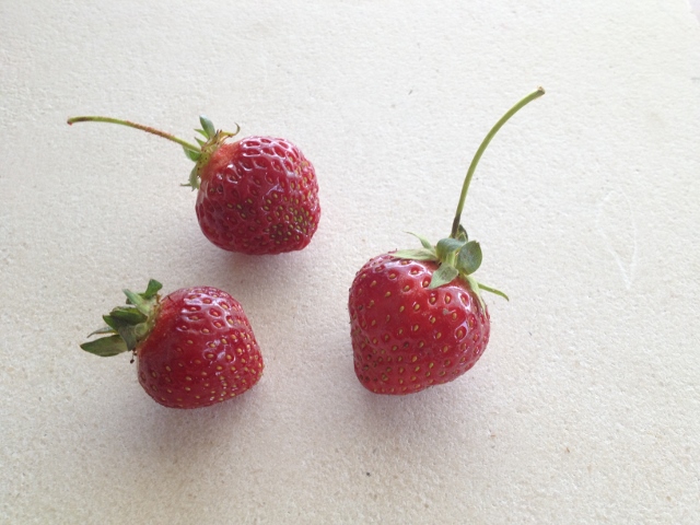 3 strawberries on marble