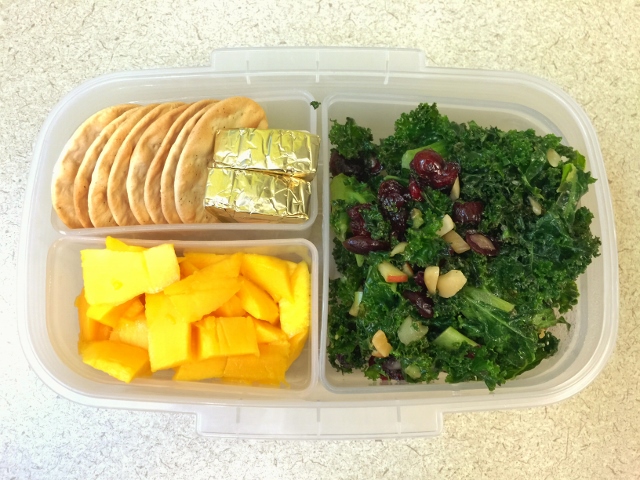 Kale salad, mango, cheese, crackers bento lunch