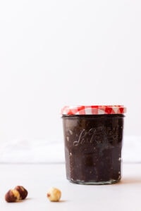 Jar of homemade nutella with a red checkered lid