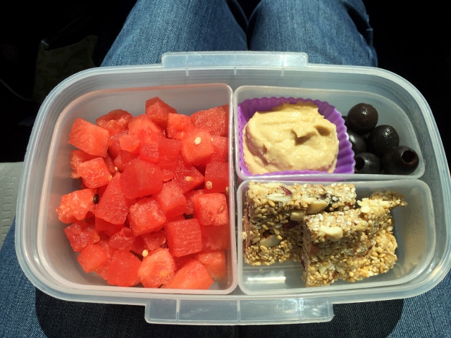 Watermelon, hummus, olives, granola bar bento lunch