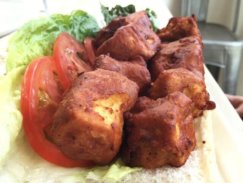 Deep fried tofu cubes on bread with lettuce and tomato