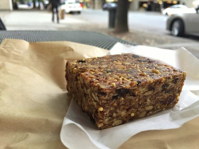 Extra thick granola bar on a piece of waxed paper