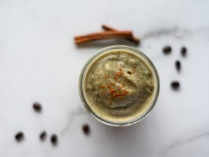 top down view of a cinnamon coffee smoothie in a jar