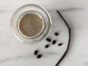 Top down view of a glass bottle filled with a coffee smoothie